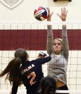 The Crusaders Laci Rose blocks a shot by Selma's Marissa Cerda in Tuesday's second set. The Crusaders fell to the Bears 3-0 to end their playoff run.